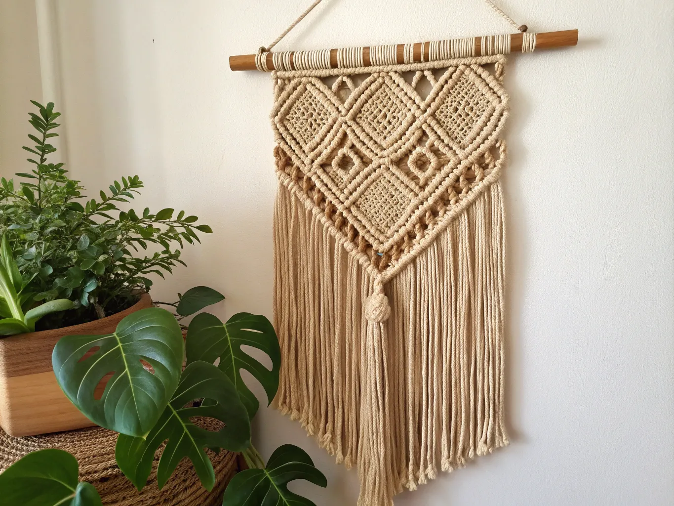 Hand-woven wall hanging with natural fibers